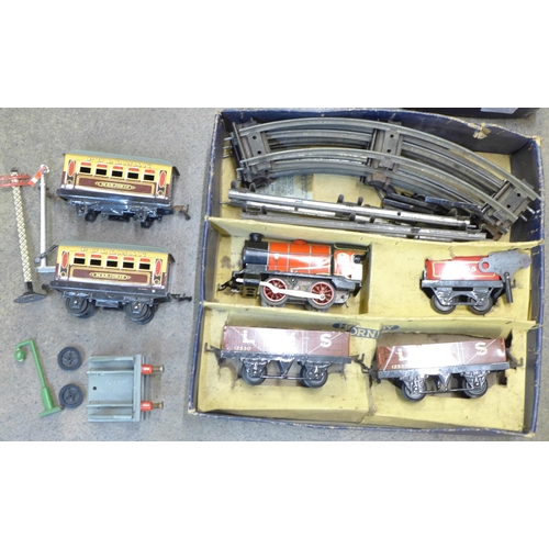 692 - A Hornby O gauge model railway set and additional model rail and accessories, (one additional carria... 