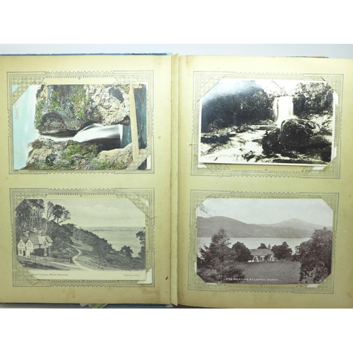 694 - 200 Edwardian and later postcards in an album