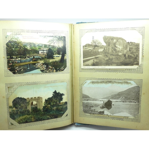 694 - 200 Edwardian and later postcards in an album