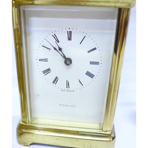 718 - Tiffany & Co, Weiss and Schatz carriage clocks, a pendulum clock and one other clock, a/f