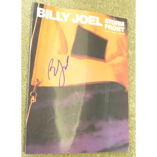 724 - A Billy Joel signed music book