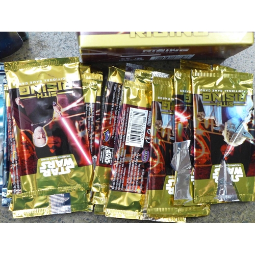 733 - A Star Wars Attack of the Clones sticker collection, a Star Wars trading card box of cards, a Sith R... 