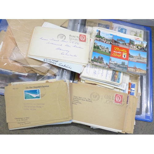 775 - A collection of stamps, used, stamped addressed envelopes, other postal history, two empty folders a... 