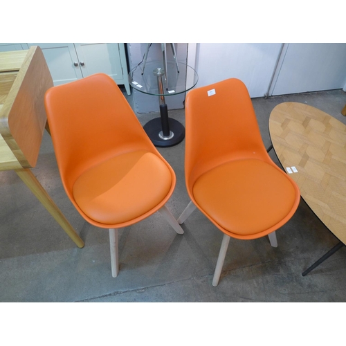 1483 - A pair of orange Eames style chairs - ref 30