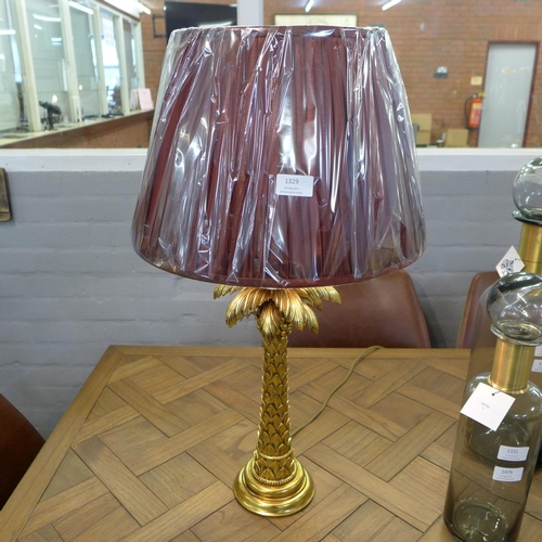 1557 - A gilt palm tree table lamp with burgundy shade (PAL423561)   #