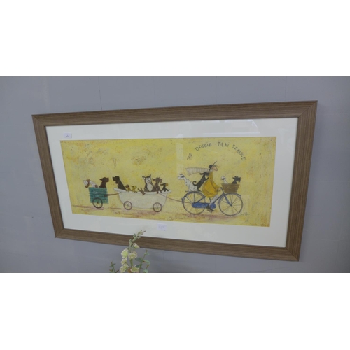 1693 - A framed print, The Doggie Taxi Service by Sam Toft, 50 x 100cm (PPFPPR41142G55)