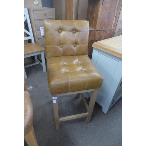 1791 - A brown leather buttoned bar stool