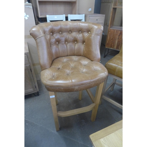 1792 - A brown leather buttoned barstool with round back