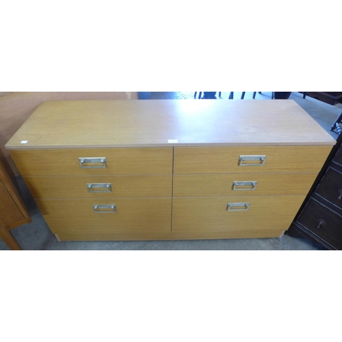 90 - A teak chest of drawers