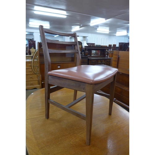 150 - A Nathan teak dining table and four chairs