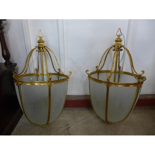 173 - A pair of large French style gilt metal and glass panelled ceiling lights