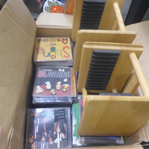 2179 - Box of at least 50 CD's, 2 small CD racks