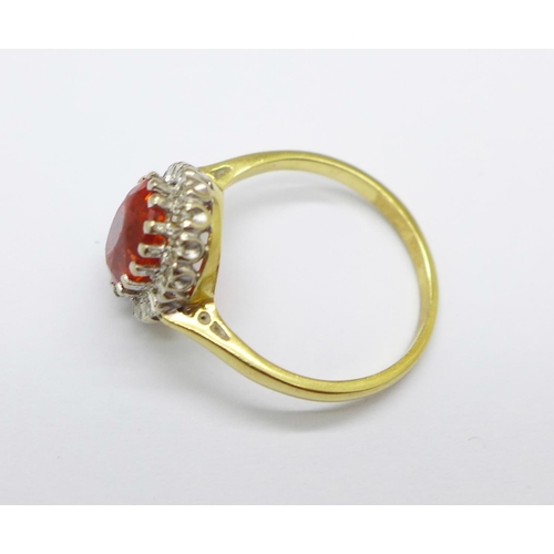 1004 - An 18ct gold, diamond and fire opal ring, 3.5g, N