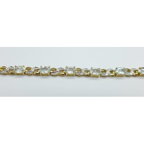 1016 - A 9ct gold, aquamarine and diamond bracelet, 8.6g