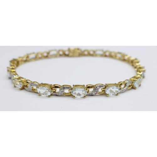 1016 - A 9ct gold, aquamarine and diamond bracelet, 8.6g