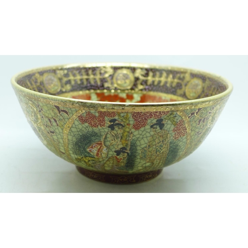 603 - A Chinese bowl, decorated with figures and outlined in gold