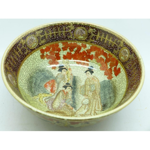 603 - A Chinese bowl, decorated with figures and outlined in gold