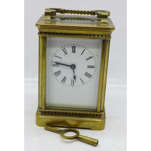 620 - A French brass cased carriage clock with key