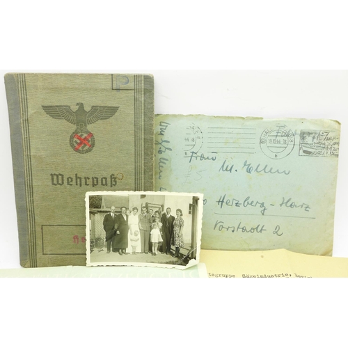 622 - A collection of German ephemera and photographs including a Third Reich Identification passbook