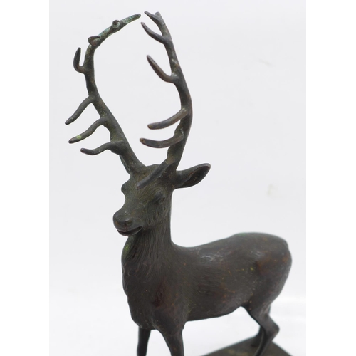 634 - An early 20th Century bronze stag car mascot, 15cm