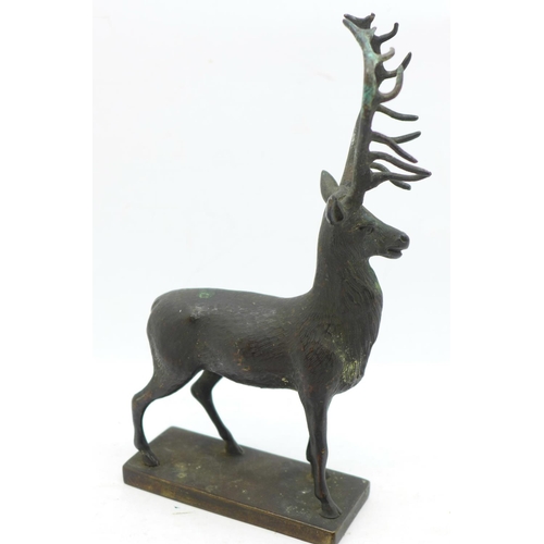 634 - An early 20th Century bronze stag car mascot, 15cm