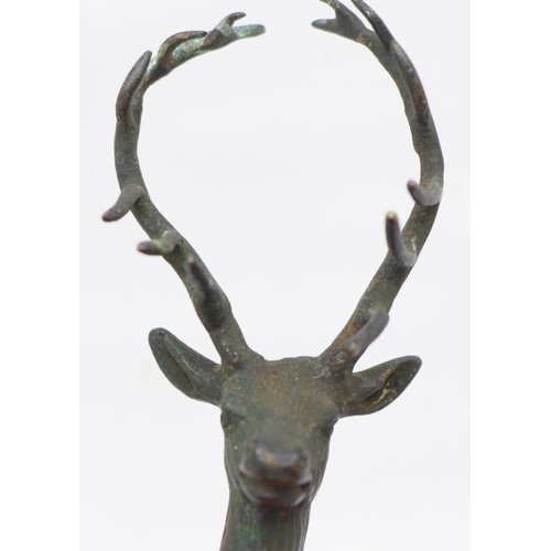 634 - An early 20th Century bronze stag car mascot, 15cm