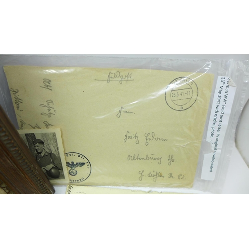 660 - Letters, photographs, a negative of a WWII soldier and a framed photograph