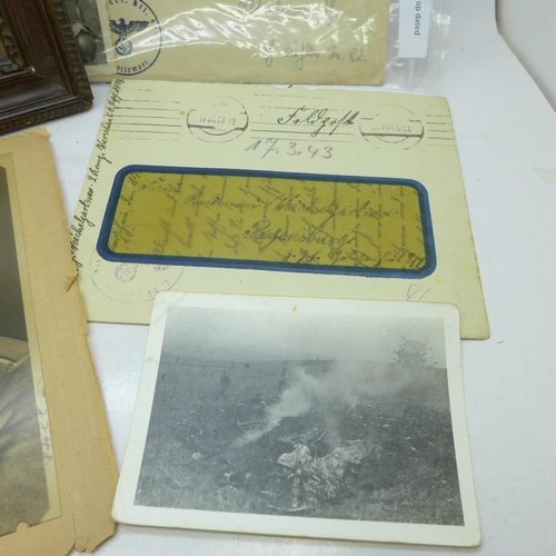 660 - Letters, photographs, a negative of a WWII soldier and a framed photograph