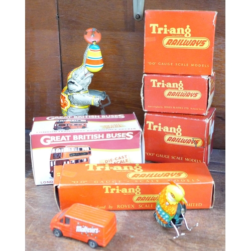 675 - A Tri-ang Royal Mail coach, other model railway accessories, two tin plate toys and a model London b... 