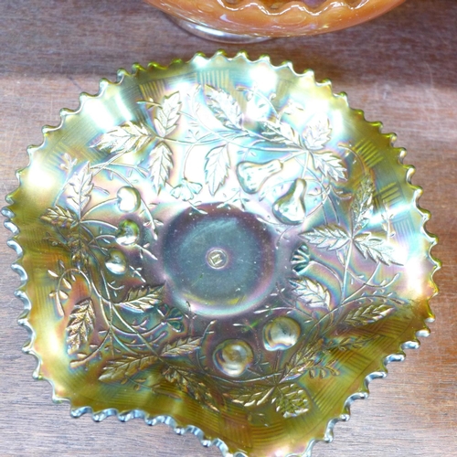 686 - Seven carnival glass dishes including green with butterfly decoration