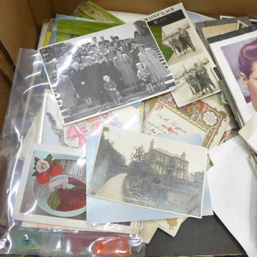 743 - Two boxes of ephemera including postcards, cigarette cards and tea cards, etc.