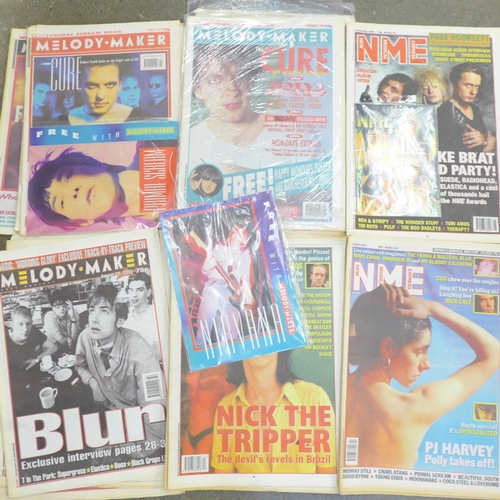 752 - Thirty NME and Melody Maker magazines - some sealed, some with free gifts