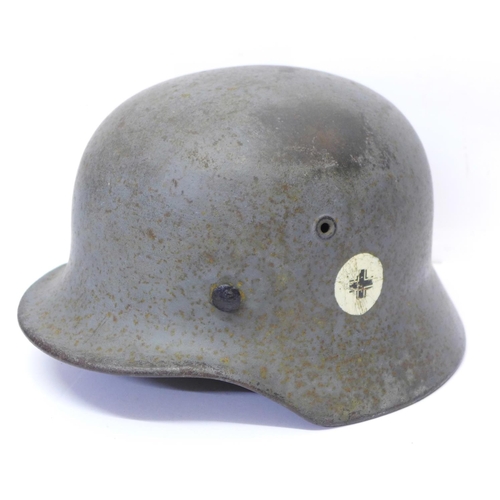 784 - A German WWII helmet, repainted