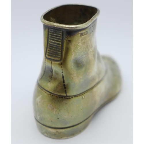 833 - A Victorian silver match holder/striker, in the form of a boot, London 1898,  156g, weighted