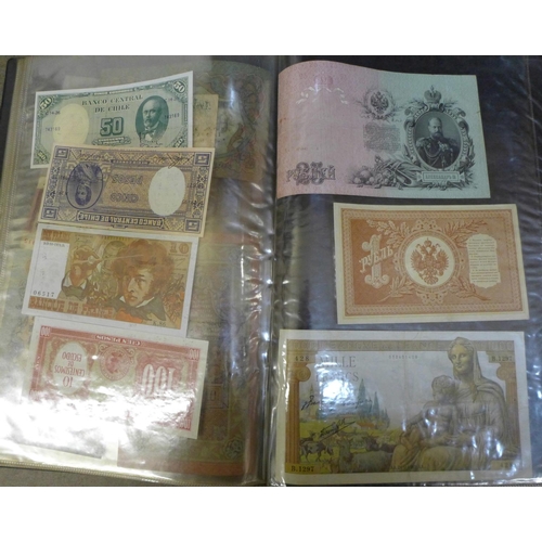 852 - An album of banknotes, including Brazil, France, Ghana, India, Chile, Russia, two Ten Shillings note... 