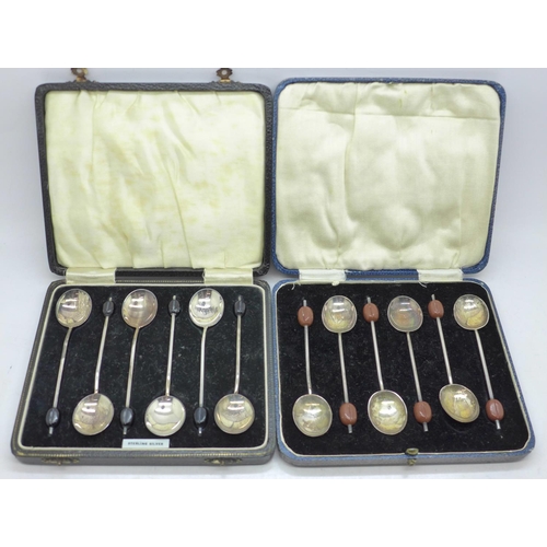 855 - Two cased sets of six silver coffee bean spoons, 73g