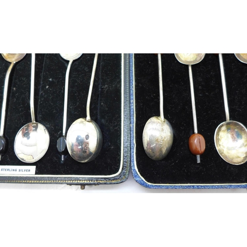 855 - Two cased sets of six silver coffee bean spoons, 73g