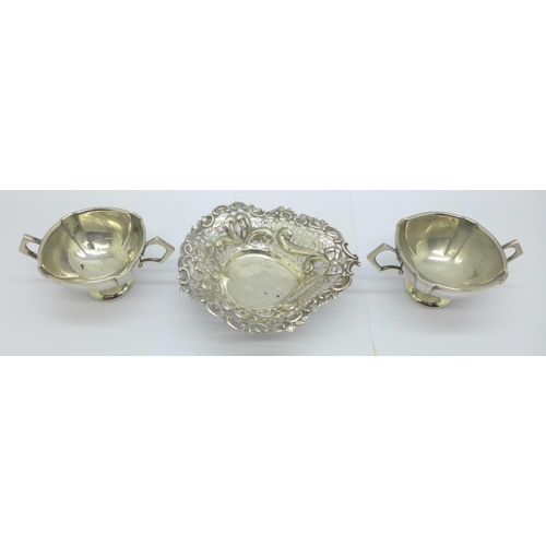 870 - A pierced silver dish and a pair of silver salts, 73g