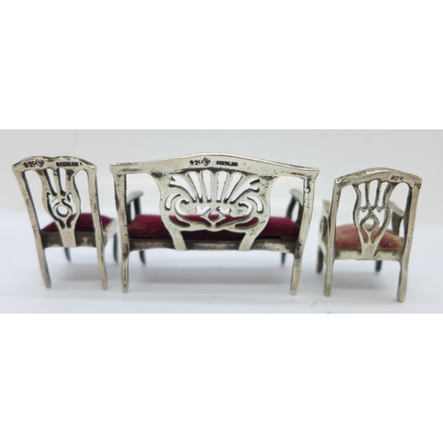 886A - A novelty 925 silver miniature three-piece lounge suite with cushioned seats