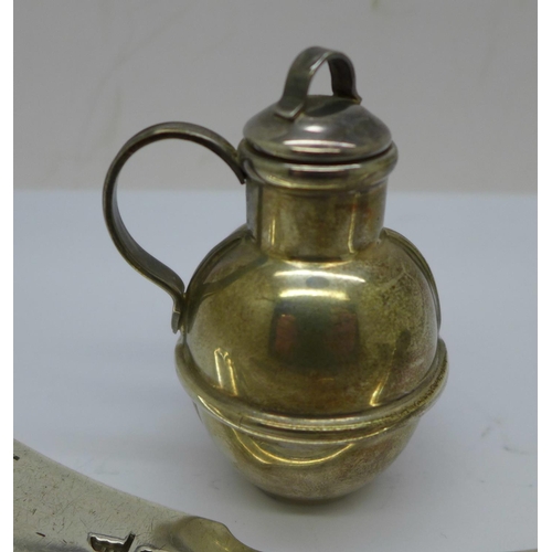 889 - A silver Guernsey jug, a ladle, etc., 191g