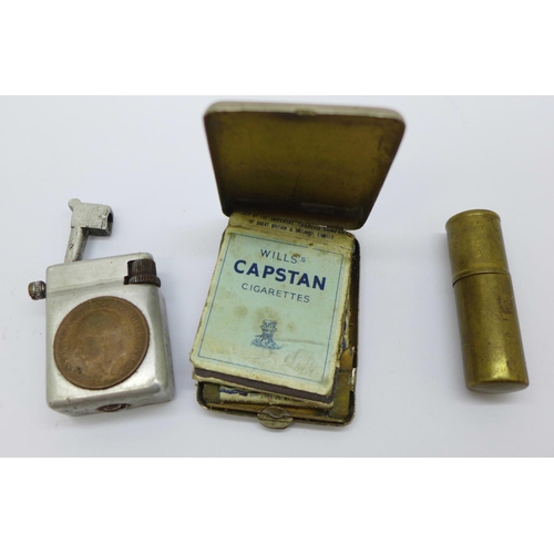 898 - A plated matchbook case with H.M.S. Emperor of India plaque and two cigarette lighters