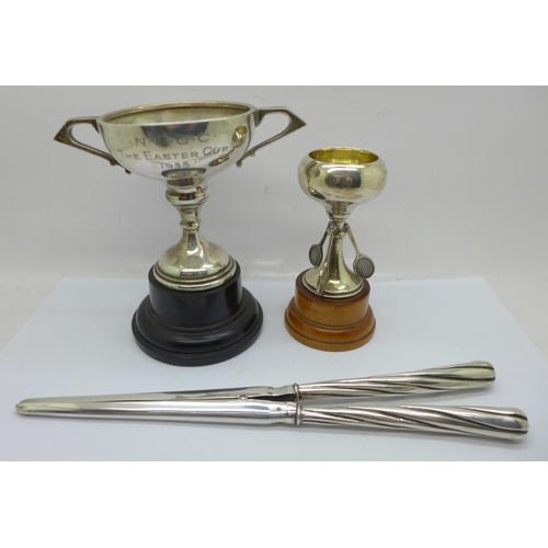 903 - Two silver trophies with inscriptions and a pair of silver handled glove stretchers, (silver 98g)