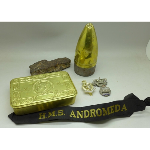 915 - A Christmas 1914 tin, a piece of shrapnel, bomb fuse, badges and a HMS Andromeda naval band