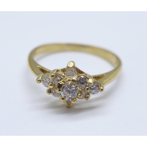 962 - A 9ct gold cluster ring, 2.3g, P, one stone replaced