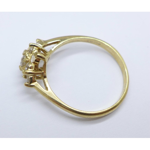 962 - A 9ct gold cluster ring, 2.3g, P, one stone replaced