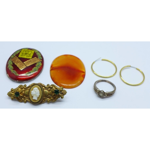 972 - An enamelled Masonic plaque, a cameo brooch, a pair earrings, a silver ring and an unmounted agate o... 