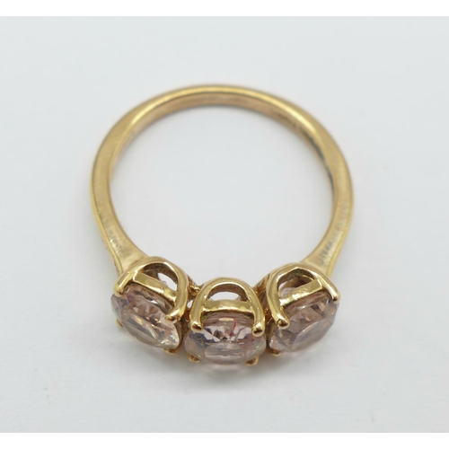 987 - A 9ct gold and morganite trilogy ring, 3.3g, N