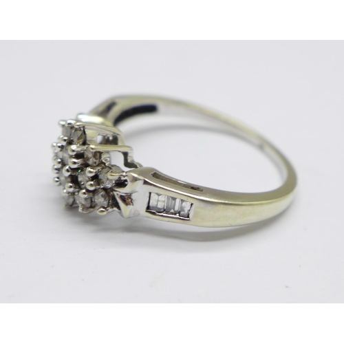 989 - A 9ct white gold diamond cluster ring with diamond shoulders, 2.6g, N