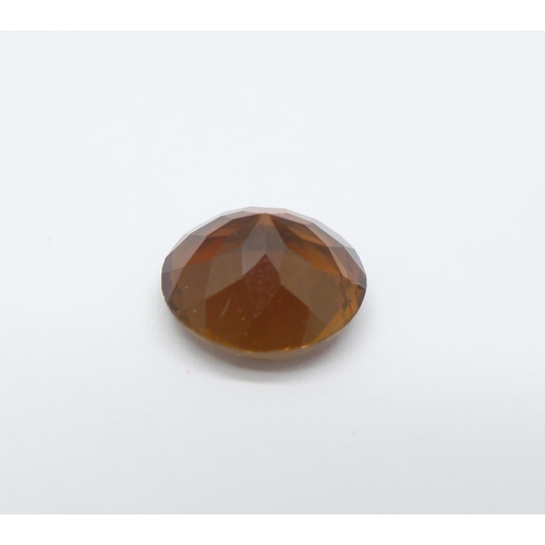 998 - An unmounted orange topaz, approximately 3.4carat weight