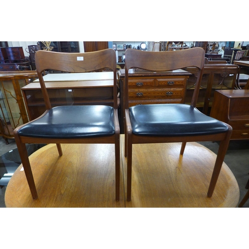 105 - A pair of Danish Neils Otto Moller model 75 teak and black vinyl chairs